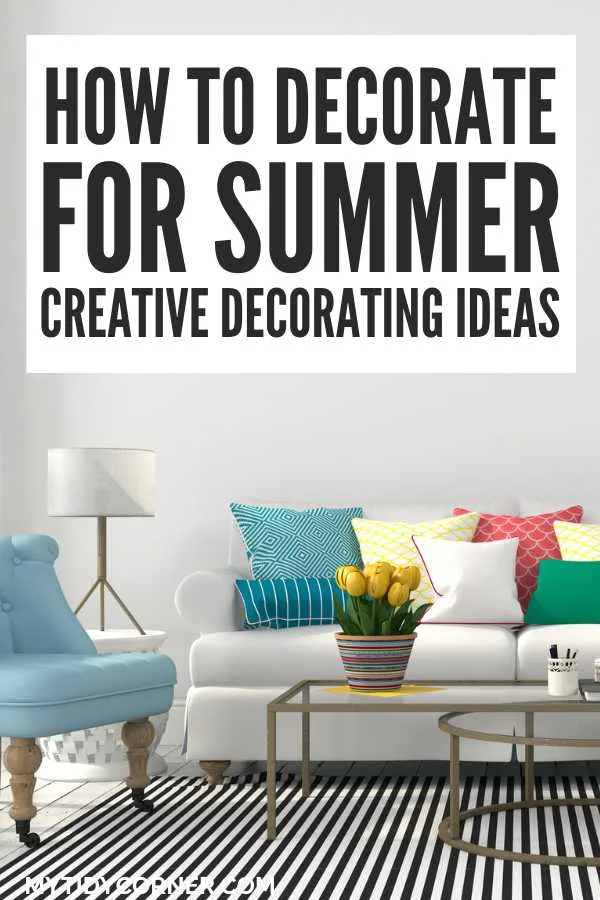 A living room with blue chair, white couch, colorful throw pillow, flower on a coffee table, lamp and text overlay that says, "How to decorate for summer, creative decorating ideas".