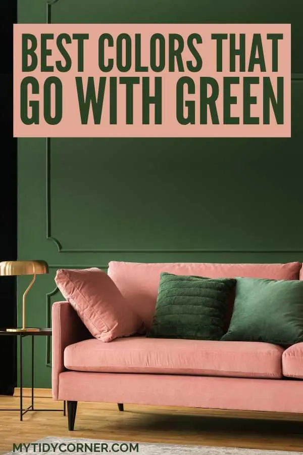 Pink and pink pillows on pink couch, lamp, green wall and text overlay that says, "Best colors that go with green".