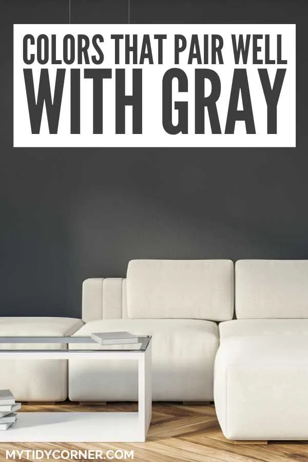 White couch and coffee table and text overlay that says, "Colors that pair well with gray".