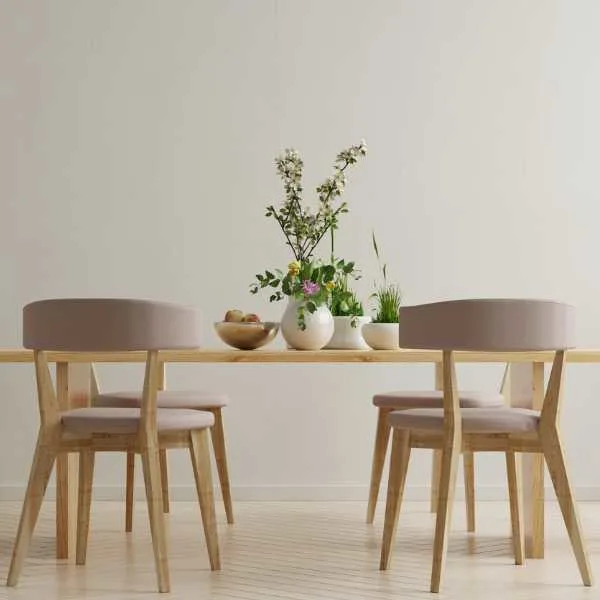 Plants and fruits on a dining table.