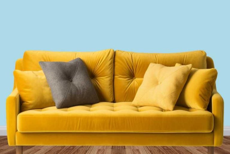 Mustard yellow sofa, blue background - Furniture and accent colors that go with light blue walls featured image.