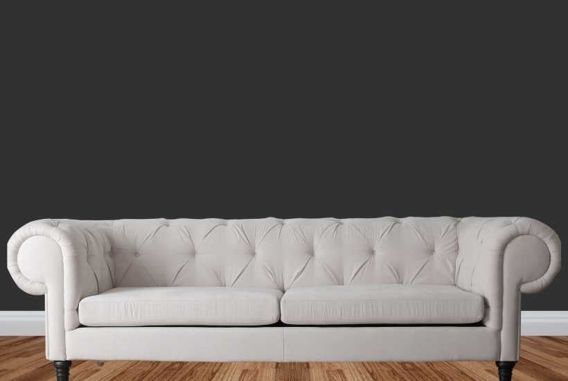 Black wall, beige couch - Featured image for "Sherwin Williams black paint colors "blog post.